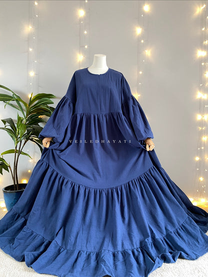 Mannequin wearing a navy blue colored organic 100% cotton abaya. Dark blue pure cotton abaya. Natural abaya with nursing friendly hidden zipper and deep pockets. Cute modest cotton abaya. All natural.
