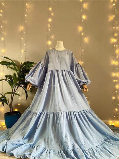 Mannequin wearing a pastel blue organic 100% cotton abaya. Light blue pure cotton abaya. Natural abaya with nursing friendly hidden zipper and deep pockets. Cute modest cotton abaya. All natural.